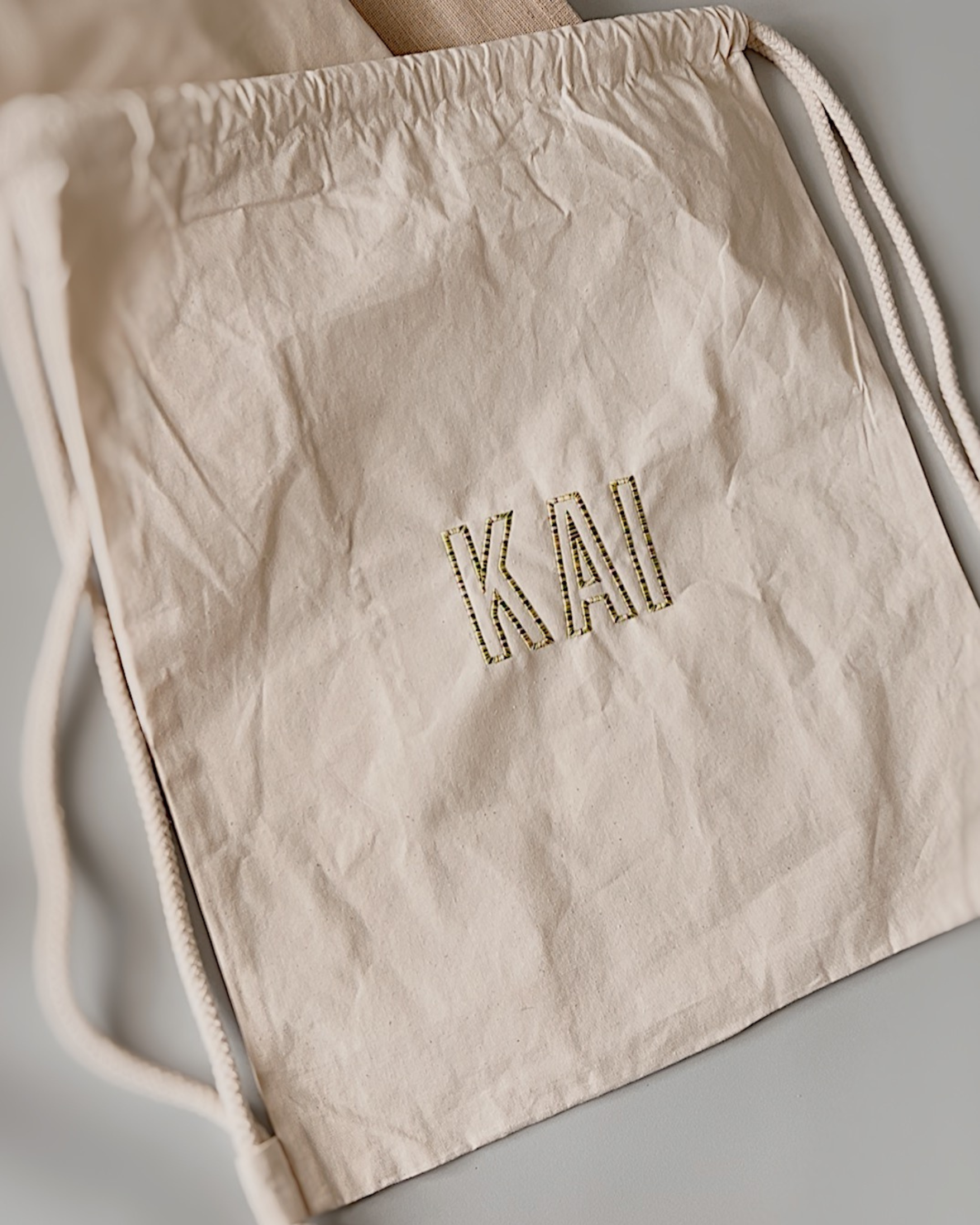 Geborduurde gymtas katoen naturel regenboog garen